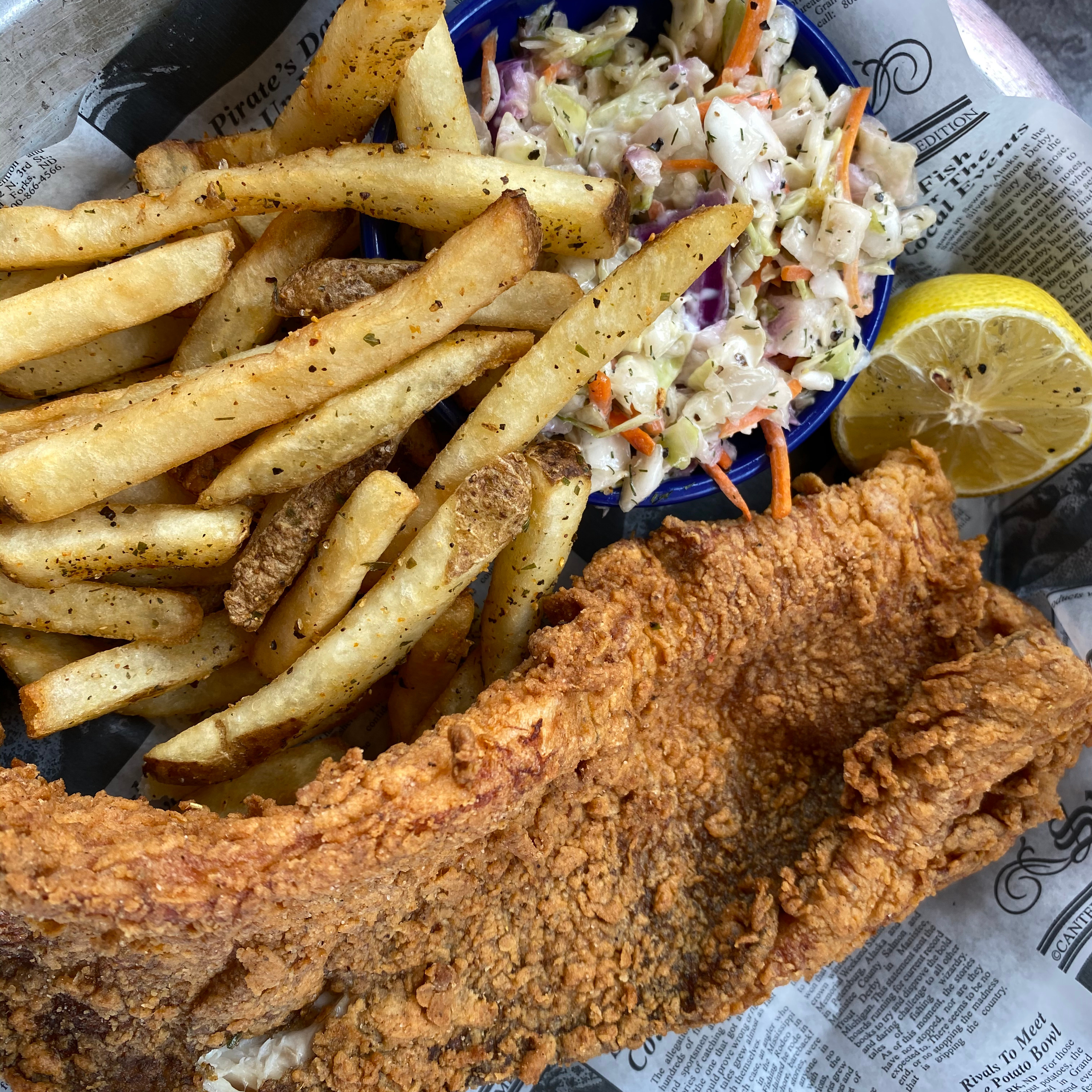 At the [Blu-moon Bistro](https://www.blumoonbistro.com) in Ludington, Michigan, Lake Whitefish was the catch of the day. Photo taken and fish eaten by Rob Wiederstein.